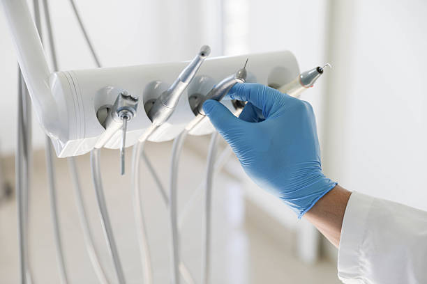 Professional Tooth Extraction technician working in Lambertville, MI